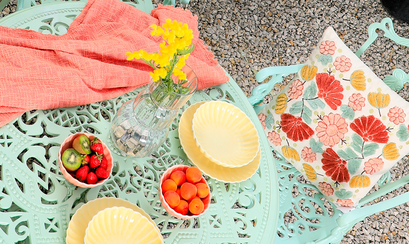 Add a touch of bistro charm to your outdoor space with elegant, compact furniture for intimate dining.